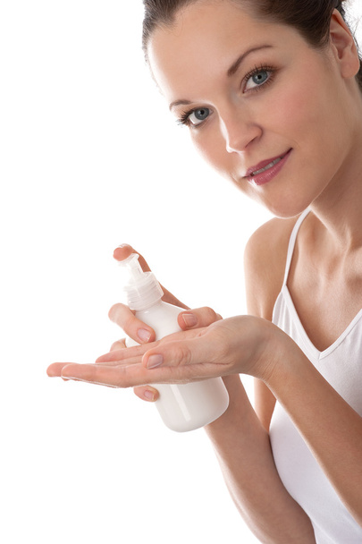Body care series - Young woman with bottle of lotion - Foto, immagini