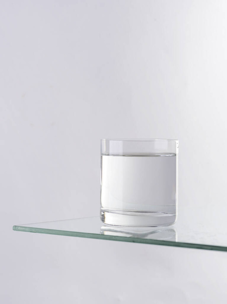 a glass of water on a white background - Фото, зображення