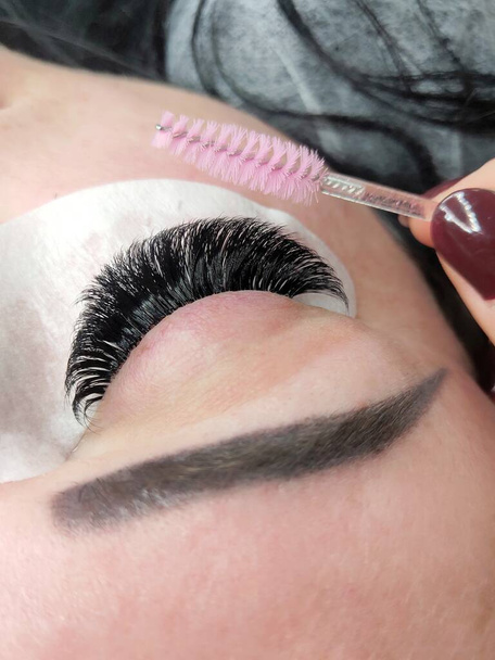 Lash extensions in beauty salon macro eye top view  - Photo, Image