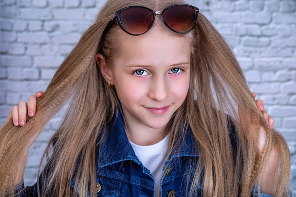 Close up portrait of girl with blond long hair and grey eyes - Фото, изображение