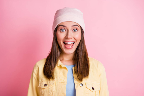 Photo of shiny surprised young lady wear casual outfit headwear open mouth isolated pink color background - Foto, immagini
