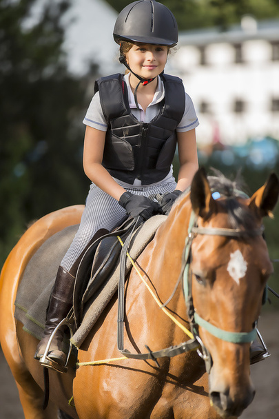 Horse riding, portrait of lovely equestrian on a horse - Foto, Imagen