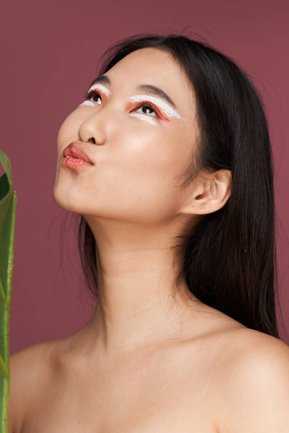 nude woman asian clean skin cosmetology pink background - Zdjęcie, obraz