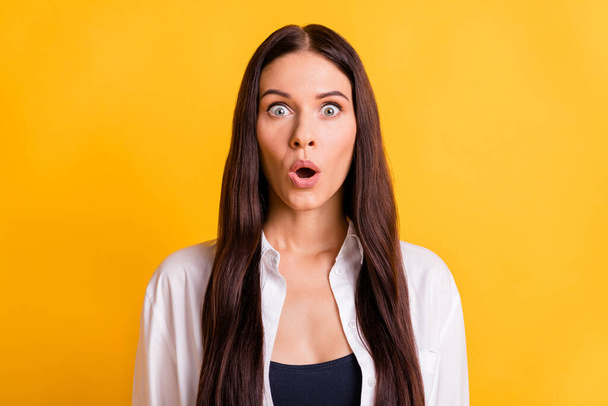 Photo of shocked astonished young nice woman reaction discount news isolated on yellow color background - Fotografie, Obrázek