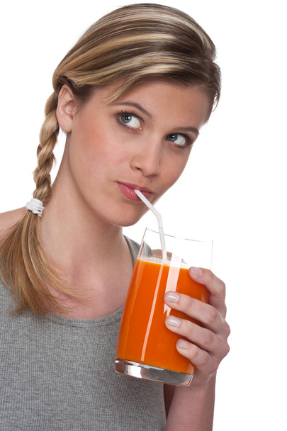 Woman drinking carrot juice on white background - Foto, afbeelding