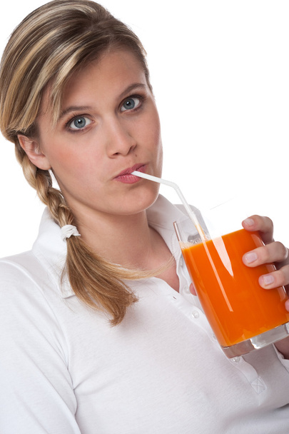 Healthy lifestyle series - Woman drinking carrot juice - 写真・画像