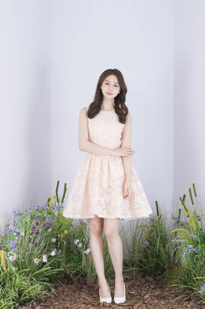 Beautiful Asian model in pink mini dress, spring fashion and beauty concept - Valokuva, kuva