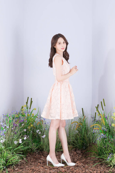Beautiful Asian model in pink mini dress, spring fashion and beauty concept - Φωτογραφία, εικόνα