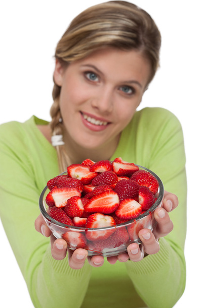 Healthy lifestyle series - Woman holding bowl of strawberries on white background - Foto, Imagem