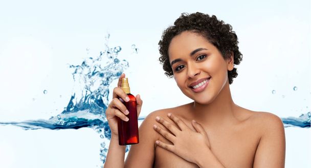 young african american woman with unscreen oil - Foto, afbeelding