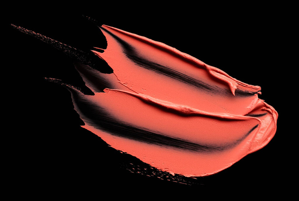 Lipstick stroke isolated on black background - Foto, afbeelding