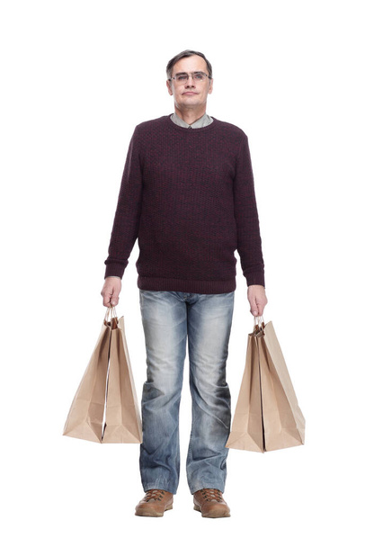 full-length. casual man with shopping bags. isolated on a white - Foto, afbeelding