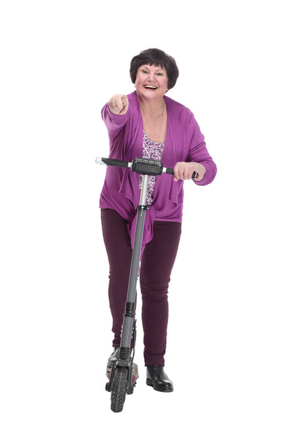 in full growth.happy senior woman with electric scooter. - Zdjęcie, obraz