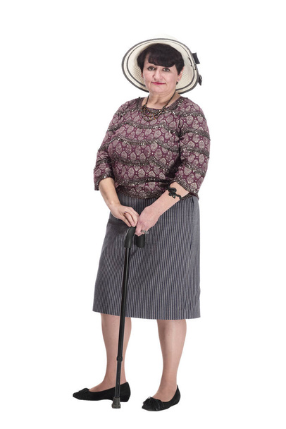 elderly woman with a walking stick in a summer hat. - Zdjęcie, obraz
