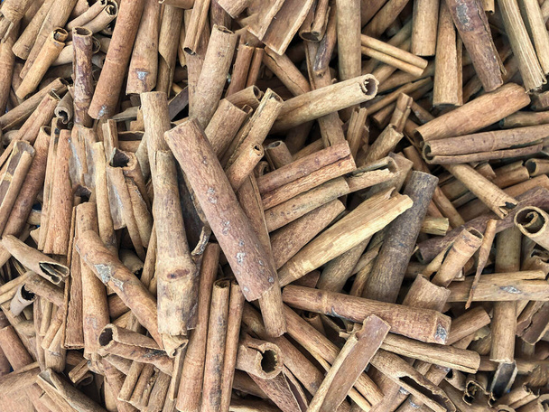 pile of dried cinnamon sticks as a background - Photo, Image