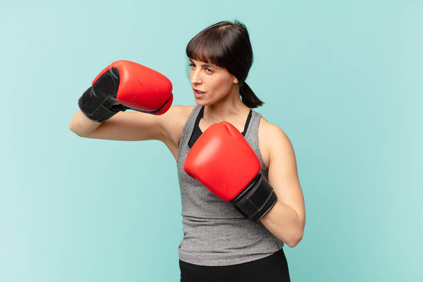 fitness woman with red boxing gloves. - Zdjęcie, obraz