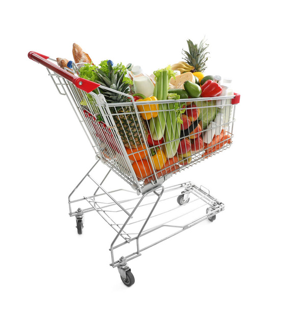 Shopping cart with groceries on white background - Photo, Image