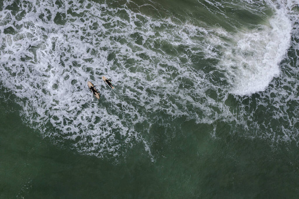 surfer on a board in rough seas - Foto, imagen