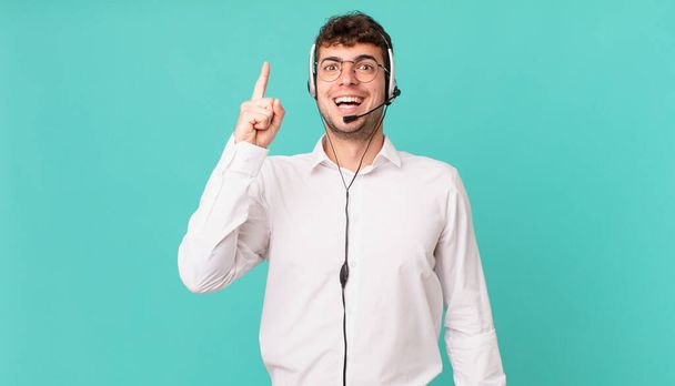telemarketer feeling like a happy and excited genius after realizing an idea, cheerfully raising finger, eureka! - Fotoğraf, Görsel