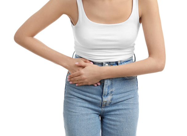 Woman suffering from appendicitis inflammation on white background, closeup - Фото, изображение