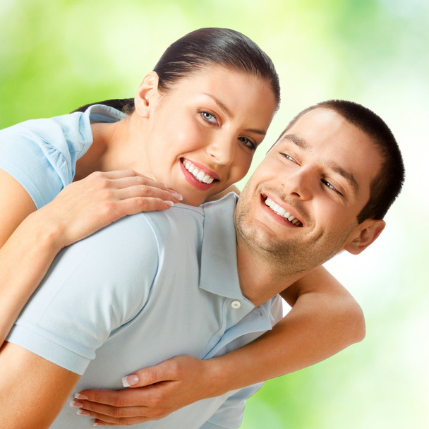 Young happy smiling attractive couple, outdoors - Photo, Image