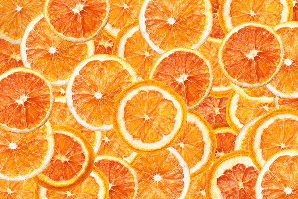 bright colored background with cut orange slices - Fotoğraf, Görsel