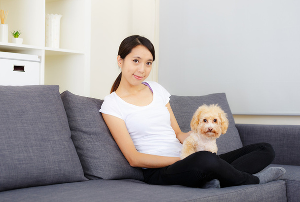 Asia woman and poodle at home - Photo, image