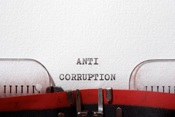 Anti corruption phrase written with a typewriter. - Photo, Image