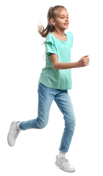 Cute little girl running on white background - Zdjęcie, obraz