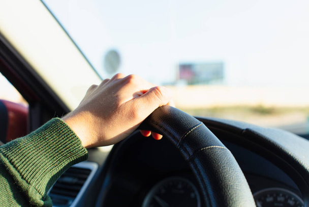 Woman holding steering wheel and driving - Foto, Imagem