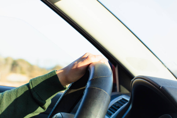 Woman holding steering wheel and driving - Φωτογραφία, εικόνα