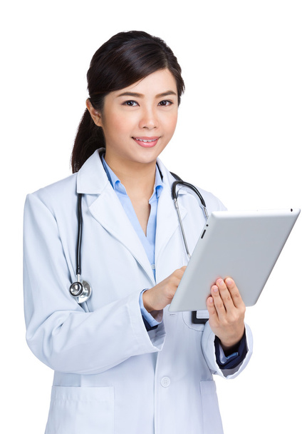 Asian doctor using digital table - Valokuva, kuva