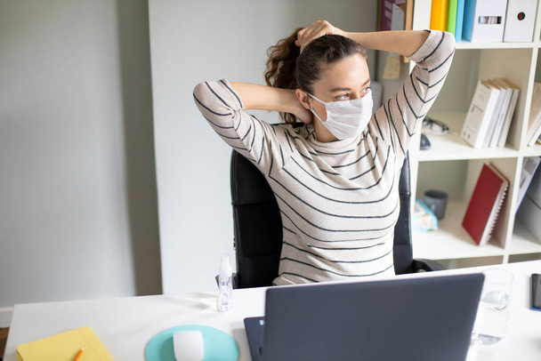 Young woman working from home after coronavirus pandemic - Foto, imagen