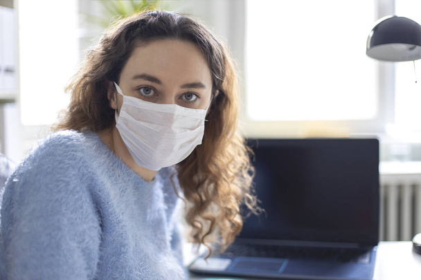 Young woman working from home after coronavirus pandemic - Фото, зображення