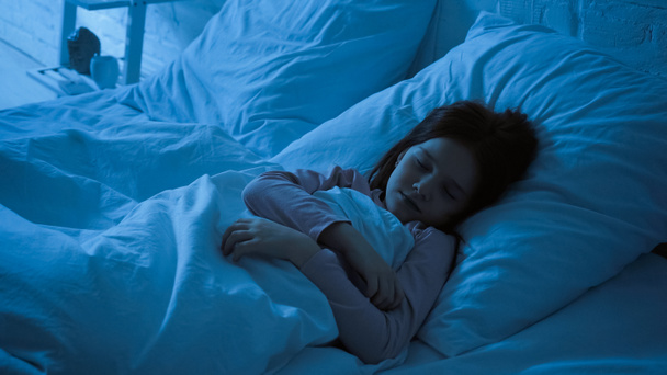 Preteen child sleeping in bedroom at night  - Foto, imagen