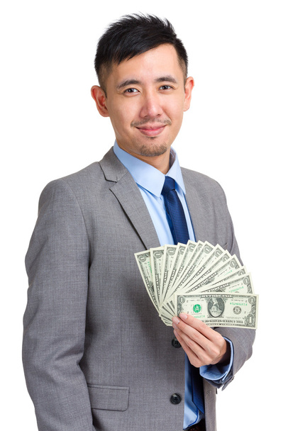 Businessman holding dollar bills  - 写真・画像