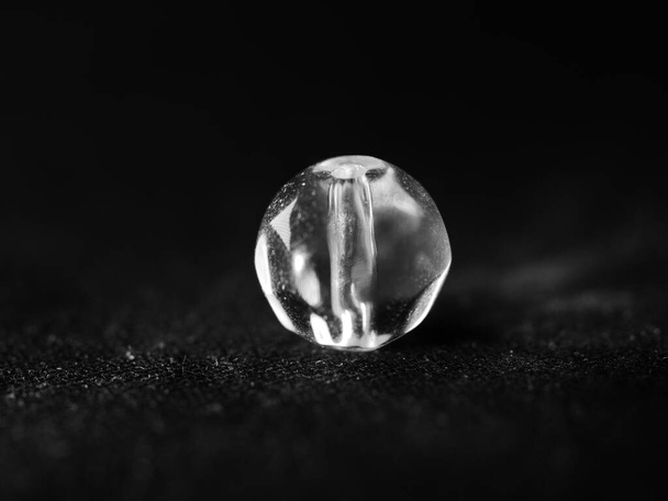 A black and white studio shot of a bead - Photo, image