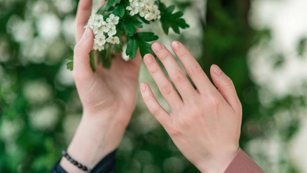 Two women hands holding and touching , selective focus, outdoor, soft atmosphere - Photo, image