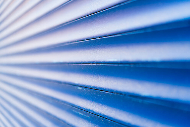 Blue metal shutters at the windows. Close up view - Foto, Imagen
