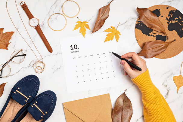 Flat lay with calendar for october with woman fashion fall accessories. - Photo, Image