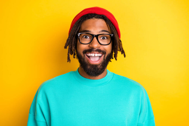 Photo of young african cheerful man happy positive smile excited surprised news sale isolated over yellow color background - Fotografie, Obrázek