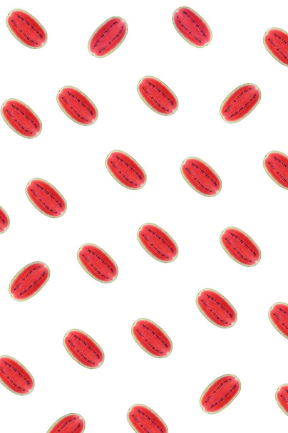 Vertical Image of Half Cut Fresh Watermelon Rows Pattern on White Background - Zdjęcie, obraz