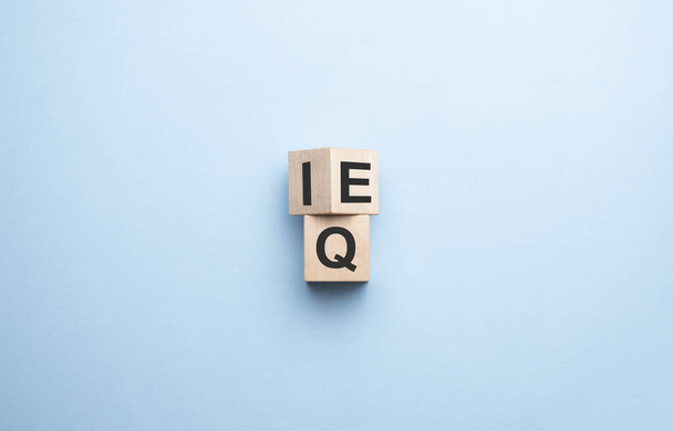 wood cube the expression IQ Intelligence Quotient to EQ Emotional Intelligence Quotient - Foto, immagini