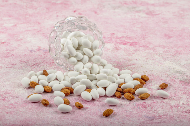 Close up of a group of white sugared almonds. Almond candies. Candies background top view, almond sweets. Sugar Feast, (Feast of Ramadan) Ramadan concepts. - Photo, Image
