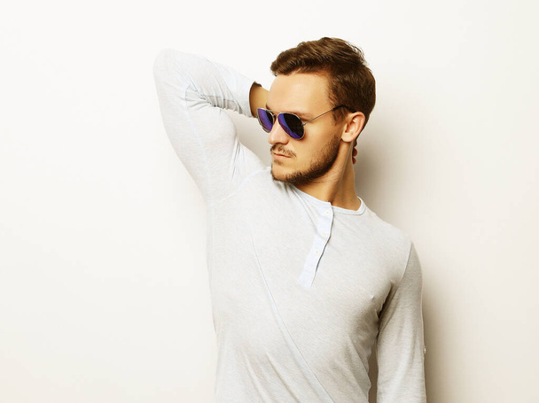 young man in smart wear, wearing fashion sunglasses - Fotografie, Obrázek
