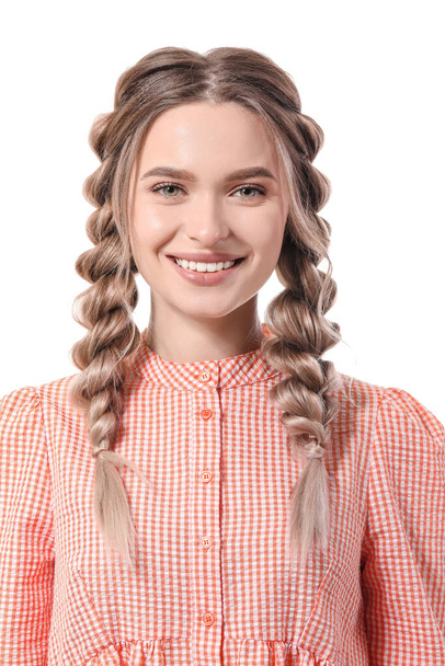 Beautiful young woman with braided hair on white background - Foto, imagen