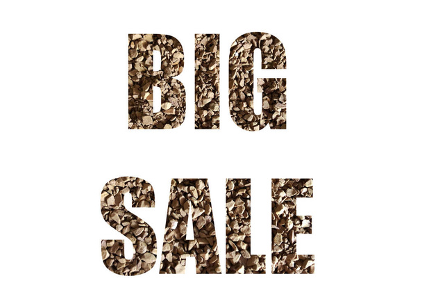 brown texture of instant coffee. Shot through the cut-out silhouette of the word BIG SALE - Fotografie, Obrázek