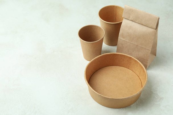 Delivery containers for takeaway food on white textured table - Fotó, kép