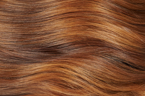 Narancs színű női frizura. textúra vörös haj háttér - Fotó, kép