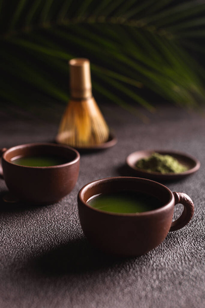 Matcha green tea in a ceramic mugs - Foto, Imagem